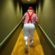 A clown walks down a hallway that is sadly not part of the actual Clown Motel. (Photo: Mario Tama / Getty Images)